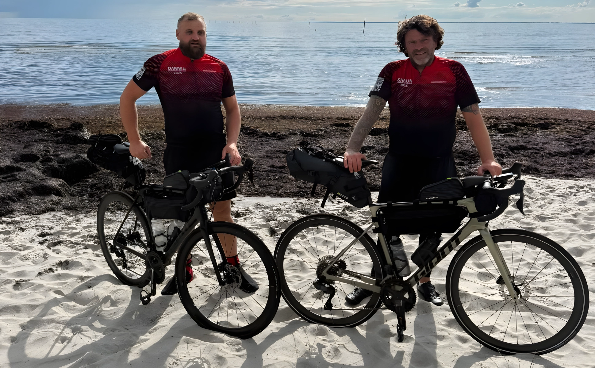 SHL Group charity cyclists completing the 1,100 mile challenge